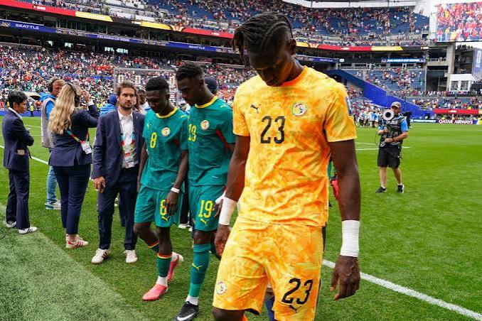 Senegal players devastated after conceding late goals and crash out of the tournament